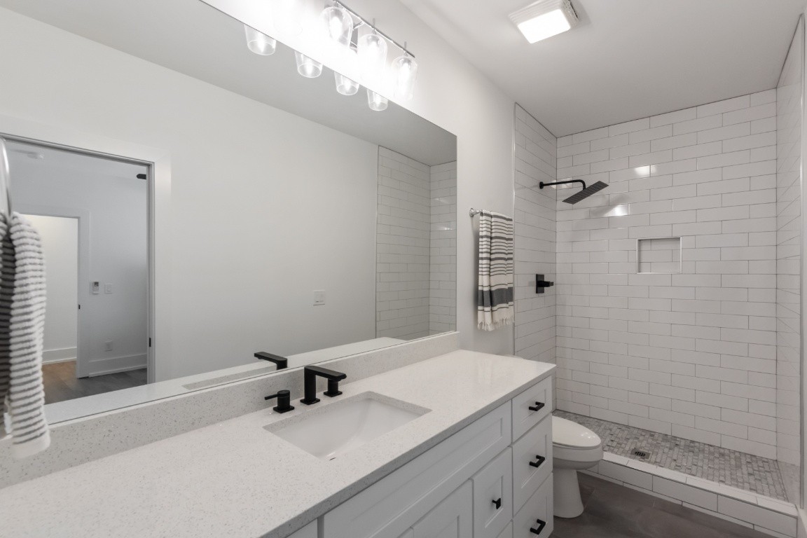 6926 Cairo Bend Road Lebanon, TN 37087 - Photo 34 of 42 a bathroom with a sink toilet and shower