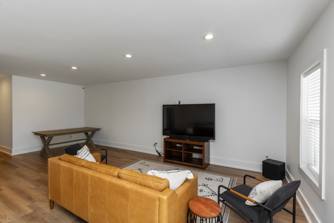 6926 Cairo Bend Road Lebanon, TN 37087 - Photo 36 of 42 a living room with furniture and a flat screen tv