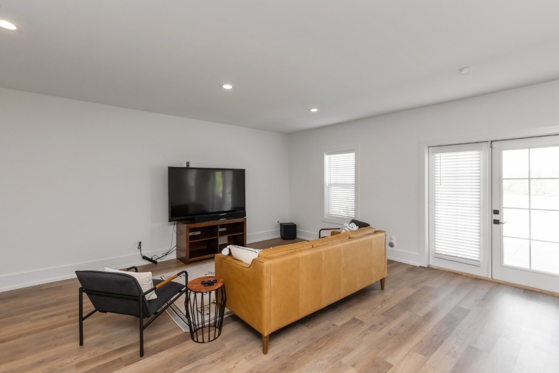 6926 Cairo Bend Road Lebanon, TN 37087 - Photo 38 of 42 a living room with furniture and a flat screen tv