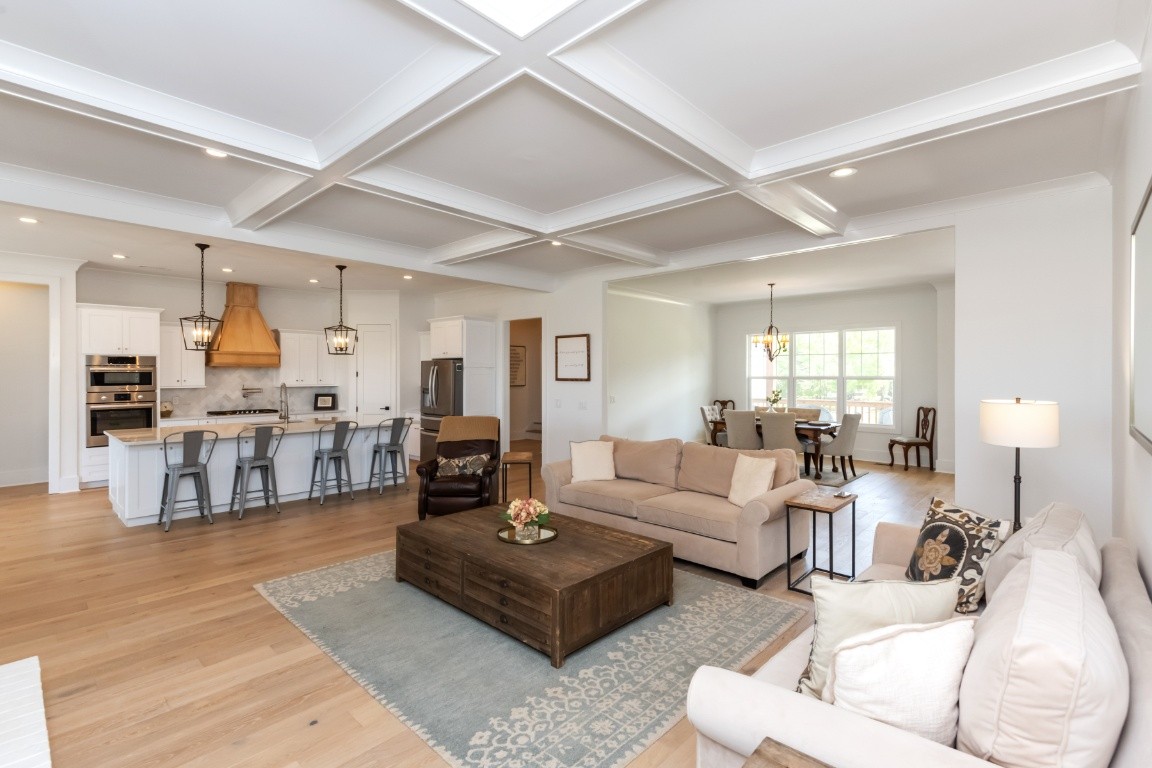 6926 Cairo Bend Road Lebanon, TN 37087 - Photo 9 of 42 a living room with furniture kitchen view and a table