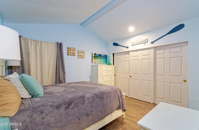 a spacious bedroom with a bed and a couch