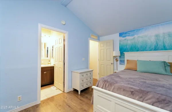 a bedroom with a bed and a dresser
