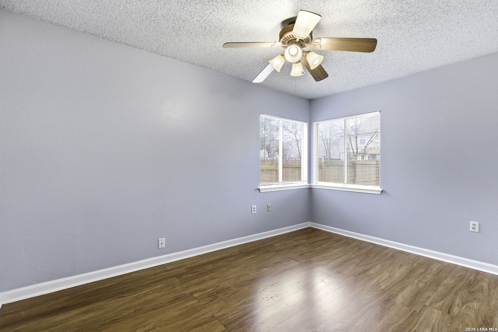 9439 Charter Point San Antonio, TX 78250 - Photo 13 of 14 wooden floor in an empty room with a window