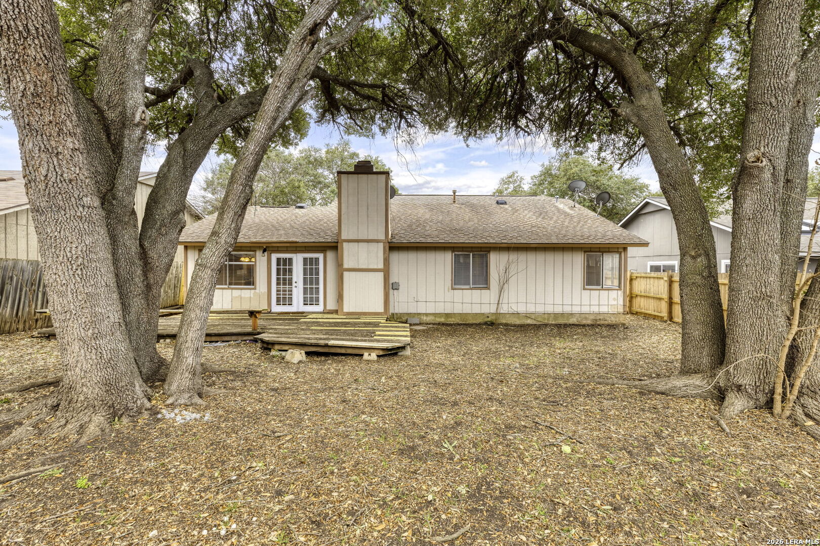 9439 Charter Point San Antonio, TX 78250 - Photo 14 of 14 a front view of a house with a yard and garage