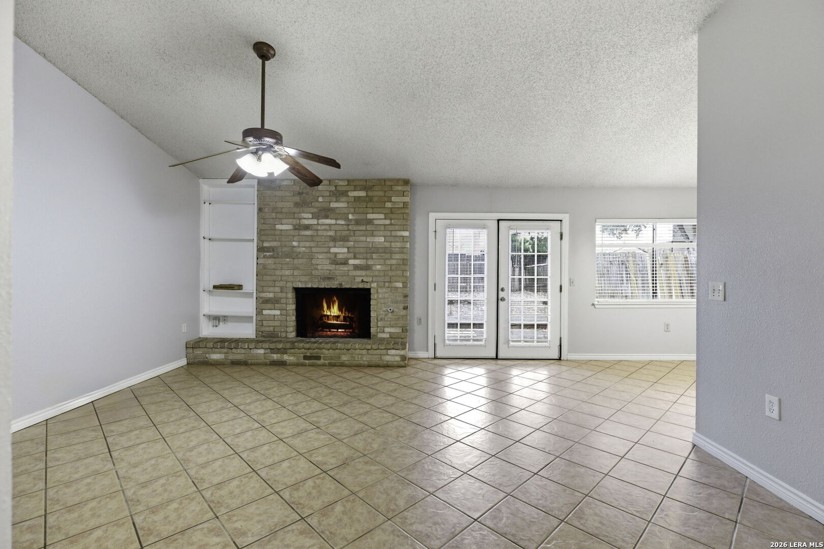 9439 Charter Point San Antonio, TX 78250 - Photo 2 of 14 a view of an empty room with a fireplace