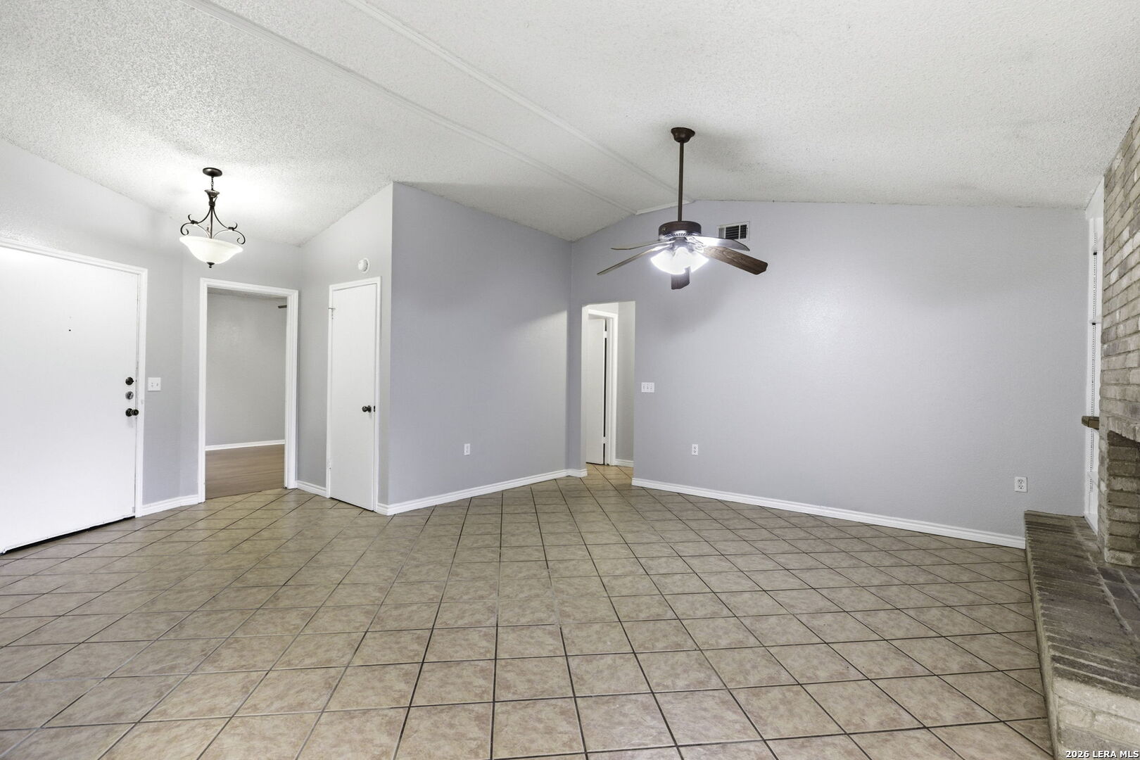 9439 Charter Point San Antonio, TX 78250 - Photo 4 of 14 a view of an empty room with chandelier fan