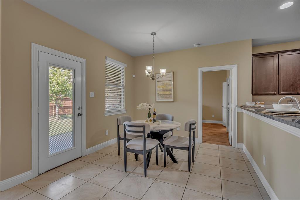 3812 Fordham Street Frisco, TX 75036 - Photo 11 of 33 a view of a dining room with furniture and chandelier