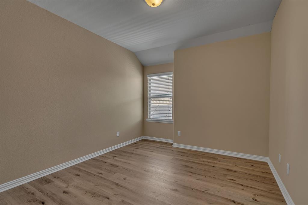 3812 Fordham Street Frisco, TX 75036 - Photo 25 of 33 a view of an empty room with wooden floor and a window