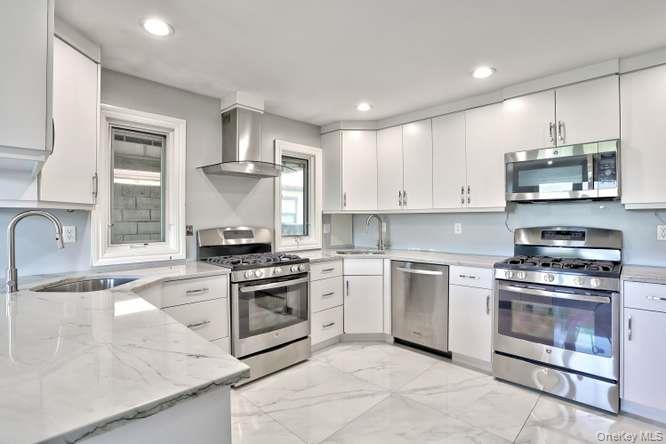60 Brewer Road Monsey, NY 10952 - Photo 12 of 32 a kitchen with stainless steel appliances granite countertop a stove a sink and a granite counter tops