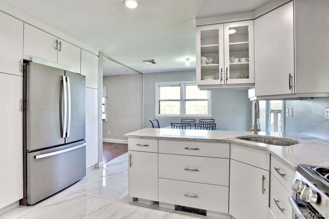 60 Brewer Road Monsey, NY 10952 - Photo 14 of 32 a kitchen with a sink appliances and cabinets