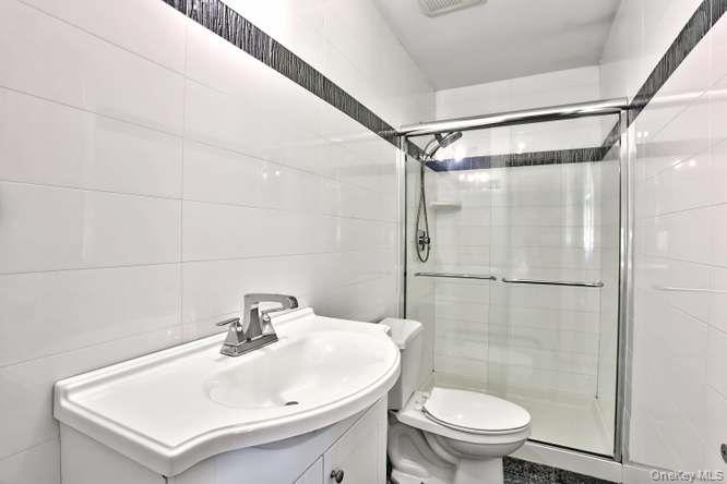 60 Brewer Road Monsey, NY 10952 - Photo 15 of 32 a bathroom with a sink toilet and shower