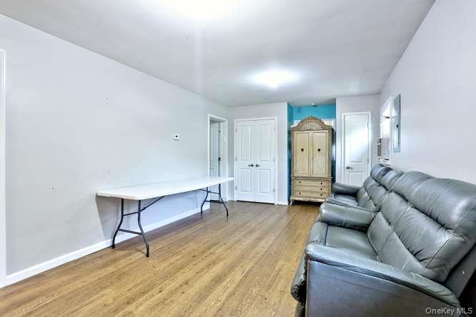 60 Brewer Road Monsey, NY 10952 - Photo 21 of 32 a living room with furniture and a wooden floor