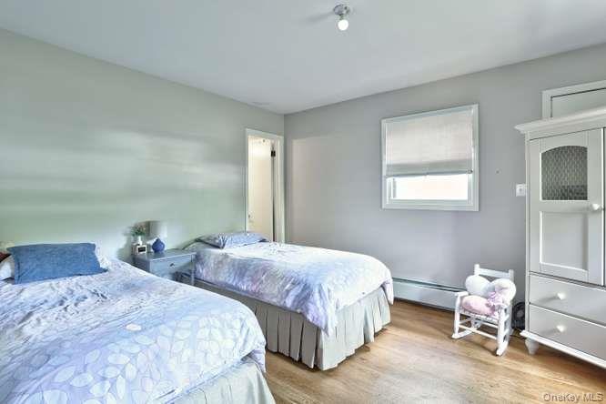 60 Brewer Road Monsey, NY 10952 - Photo 22 of 32 a bedroom with two beds and a window