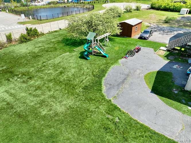 60 Brewer Road Monsey, NY 10952 - Photo 4 of 32 an aerial view of a house with a yard and lake view