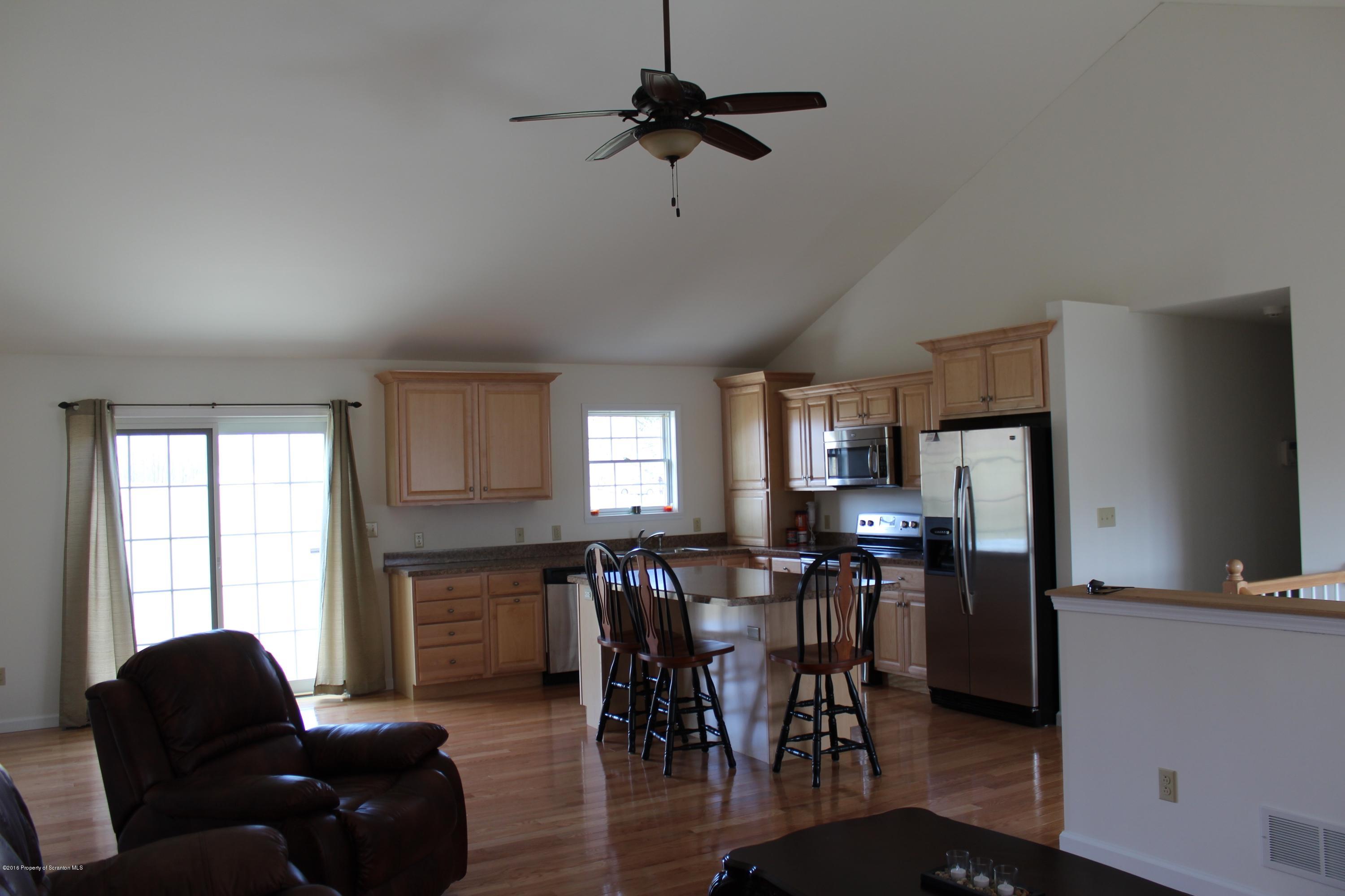 106 Rails Road Tunkhannock, PA 18657 - Photo 22 of 31 a living room with furniture flat screen tv and window