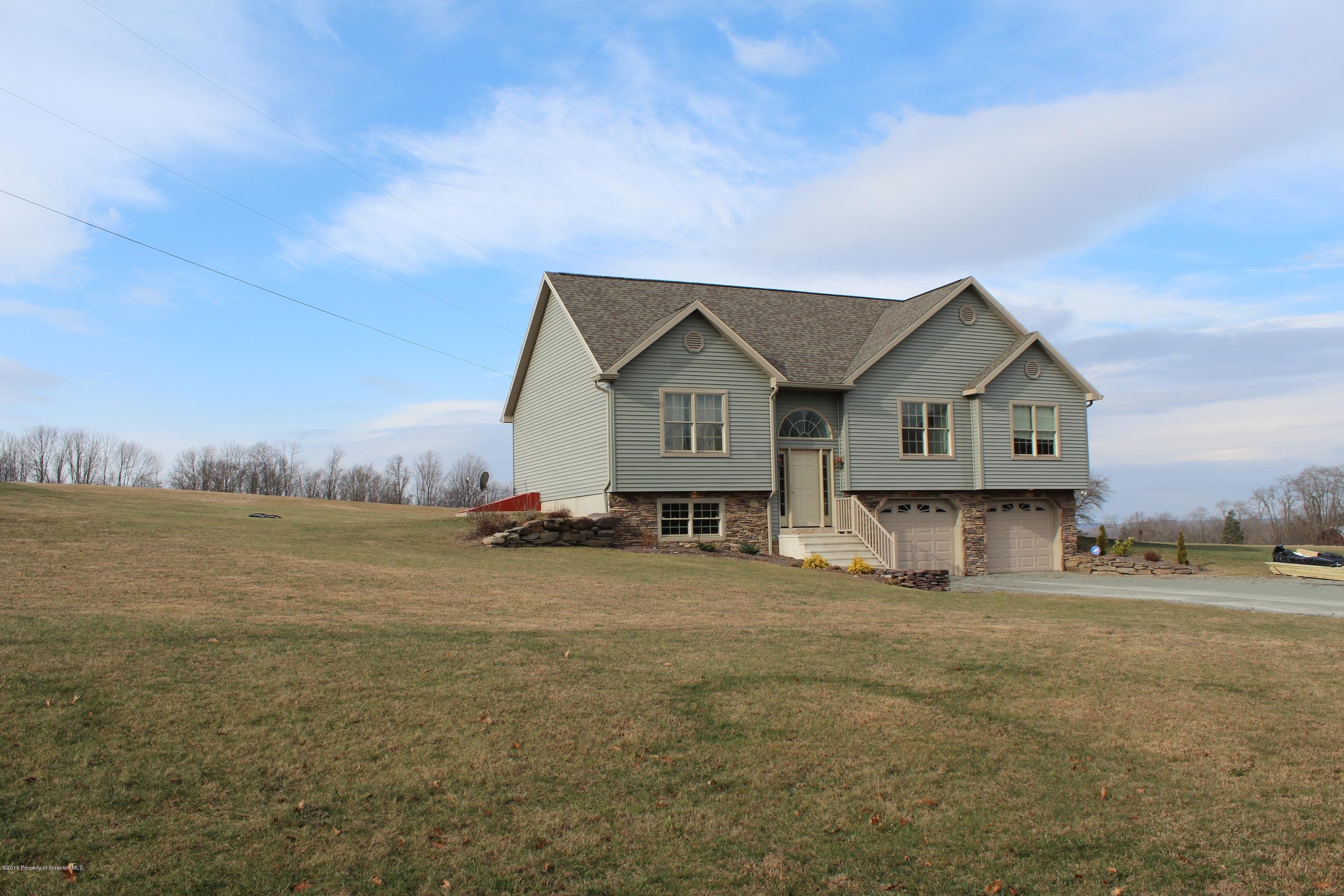 106 Rails Road Tunkhannock, PA 18657 - Photo 27 of 31 a view of a house with a big yard and large trees