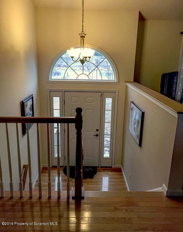 106 Rails Road Tunkhannock, PA 18657 - Photo 9 of 31 a view of a livingroom with wooden floor and entrance door