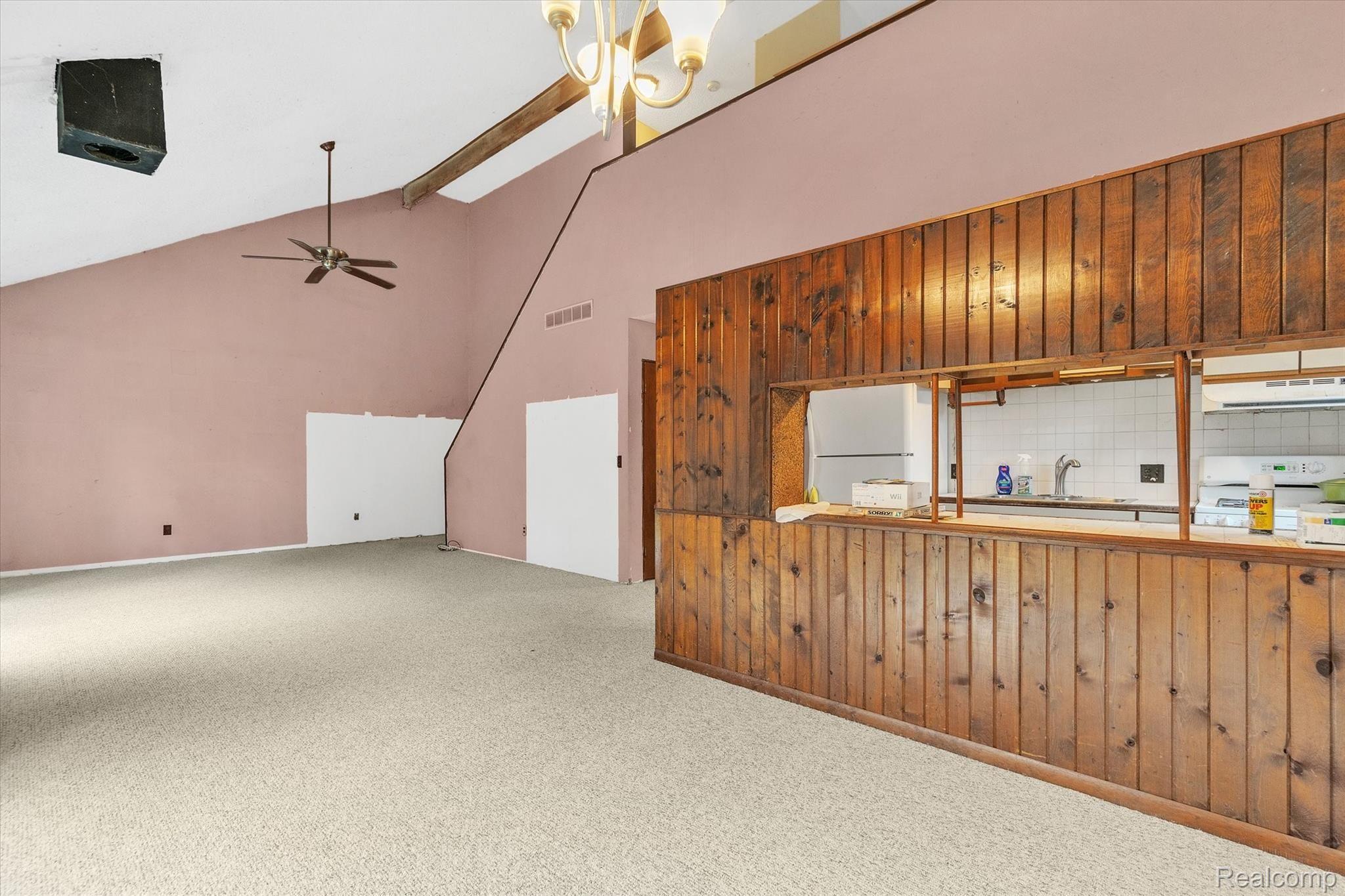 5349 Faussett Road Howell, MI 48855 - Photo 4 of 31 Vaulted ceilings with ceiling fan in large living space.