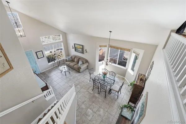a living room with furniture and a table