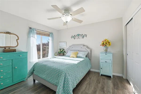 a bedroom with a bed and a dresser