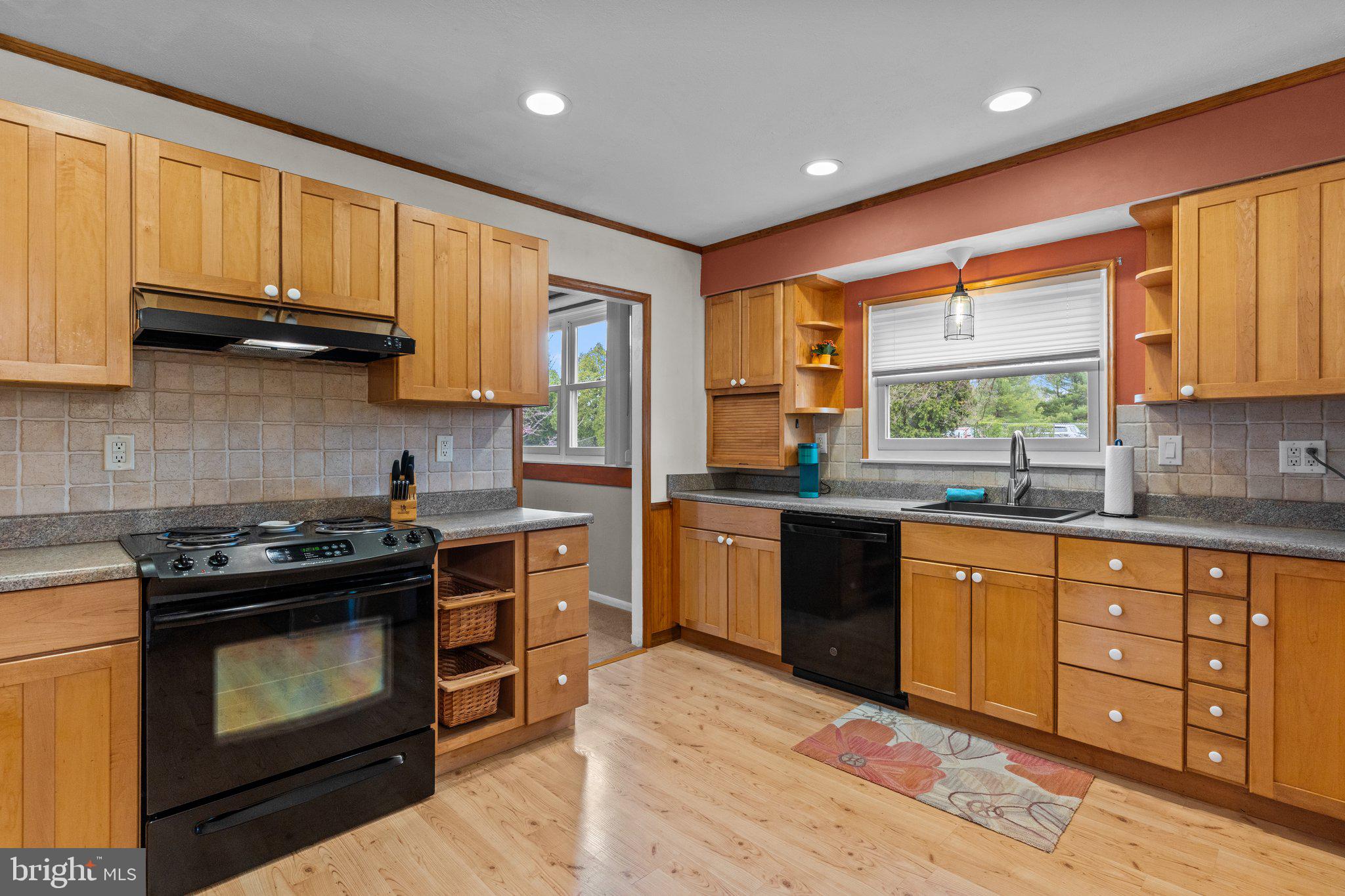 523 Byron Road Warminster, PA 18974 - Photo 3 of 33 a kitchen with stainless steel appliances granite countertop wooden cabinets stove top oven and sink