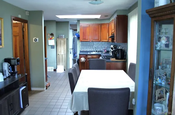 a kitchen with a table and chairs in it