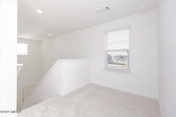 a view of a room that has a window in it