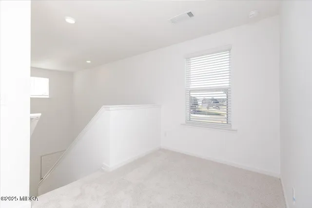 a view of a room that has a window in it