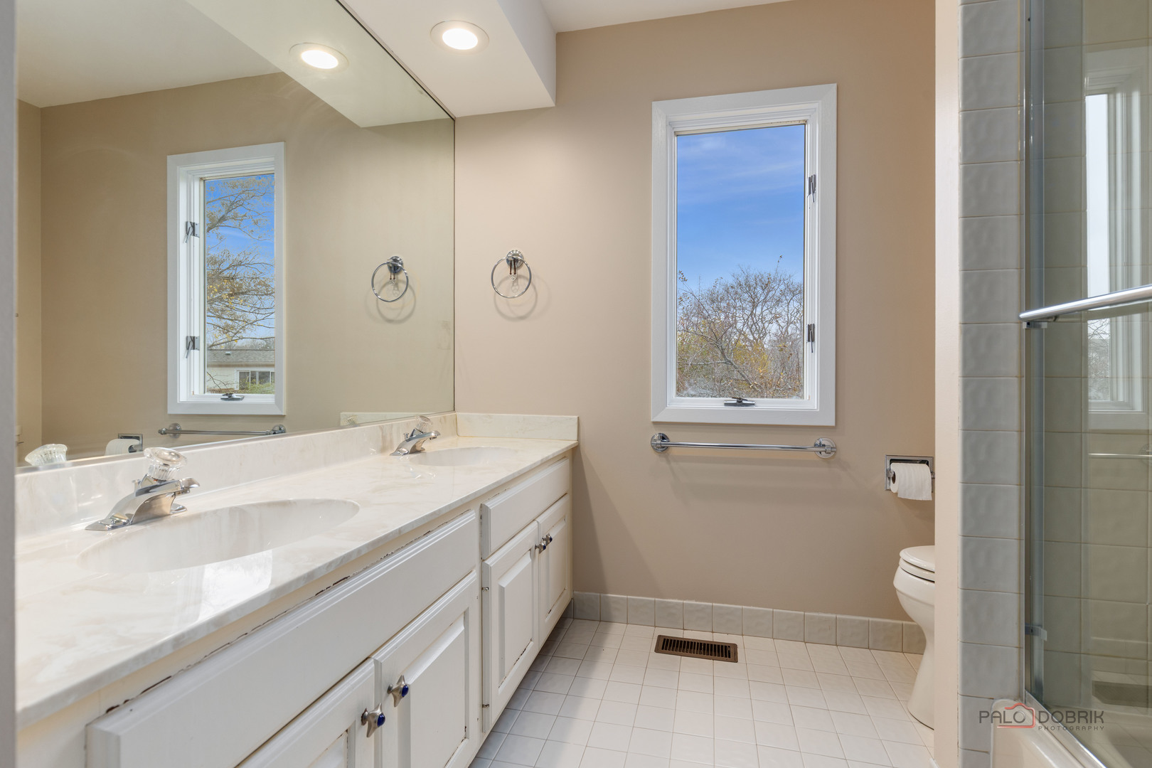 825 Downing Street Northbrook, IL 60062 - Photo 22 of 29 a bathroom with a double vanity sink toilet and shower
