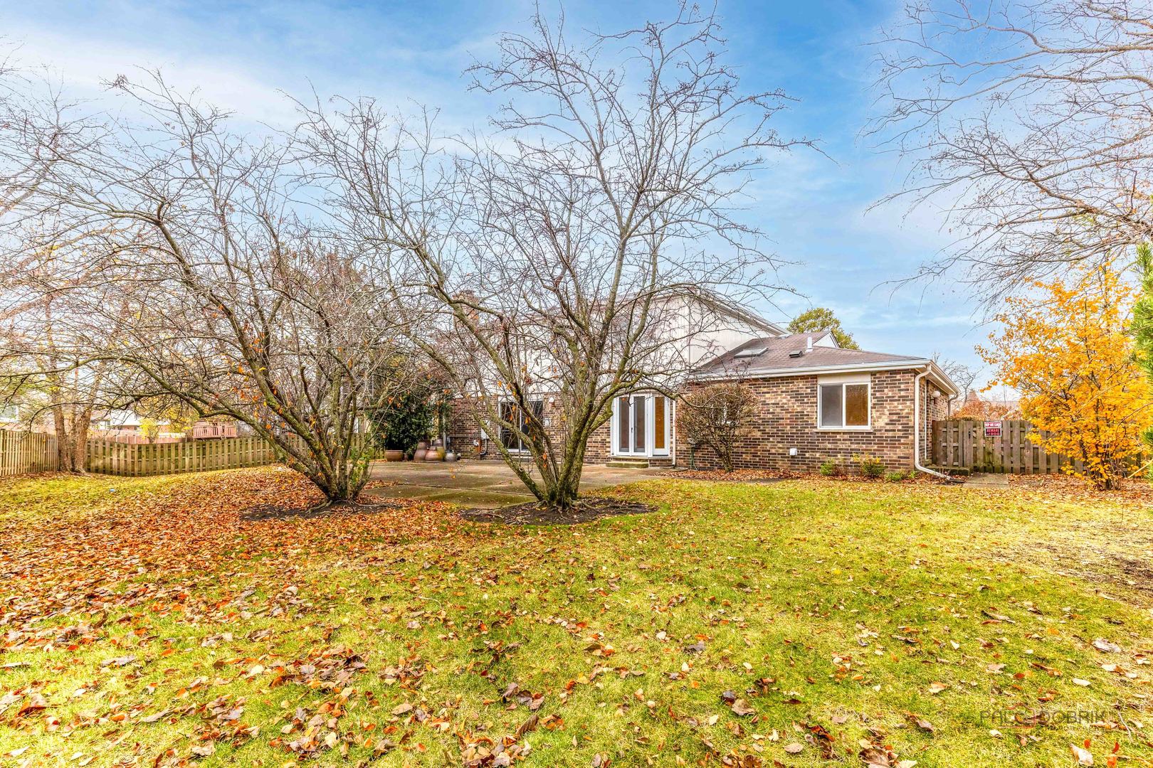 825 Downing Street Northbrook, IL 60062 - Photo 27 of 29 a front view of a house with a yard covered with snow