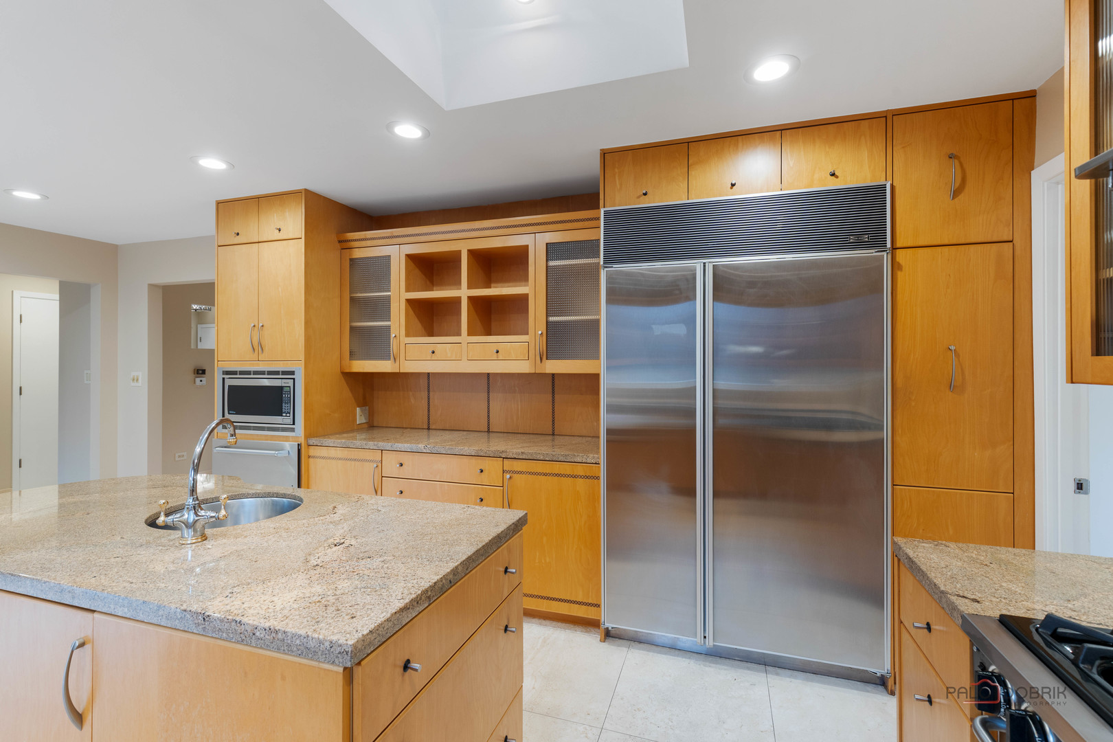 825 Downing Street Northbrook, IL 60062 - Photo 5 of 29 a kitchen with kitchen island a counter top space cabinets and stainless steel appliances