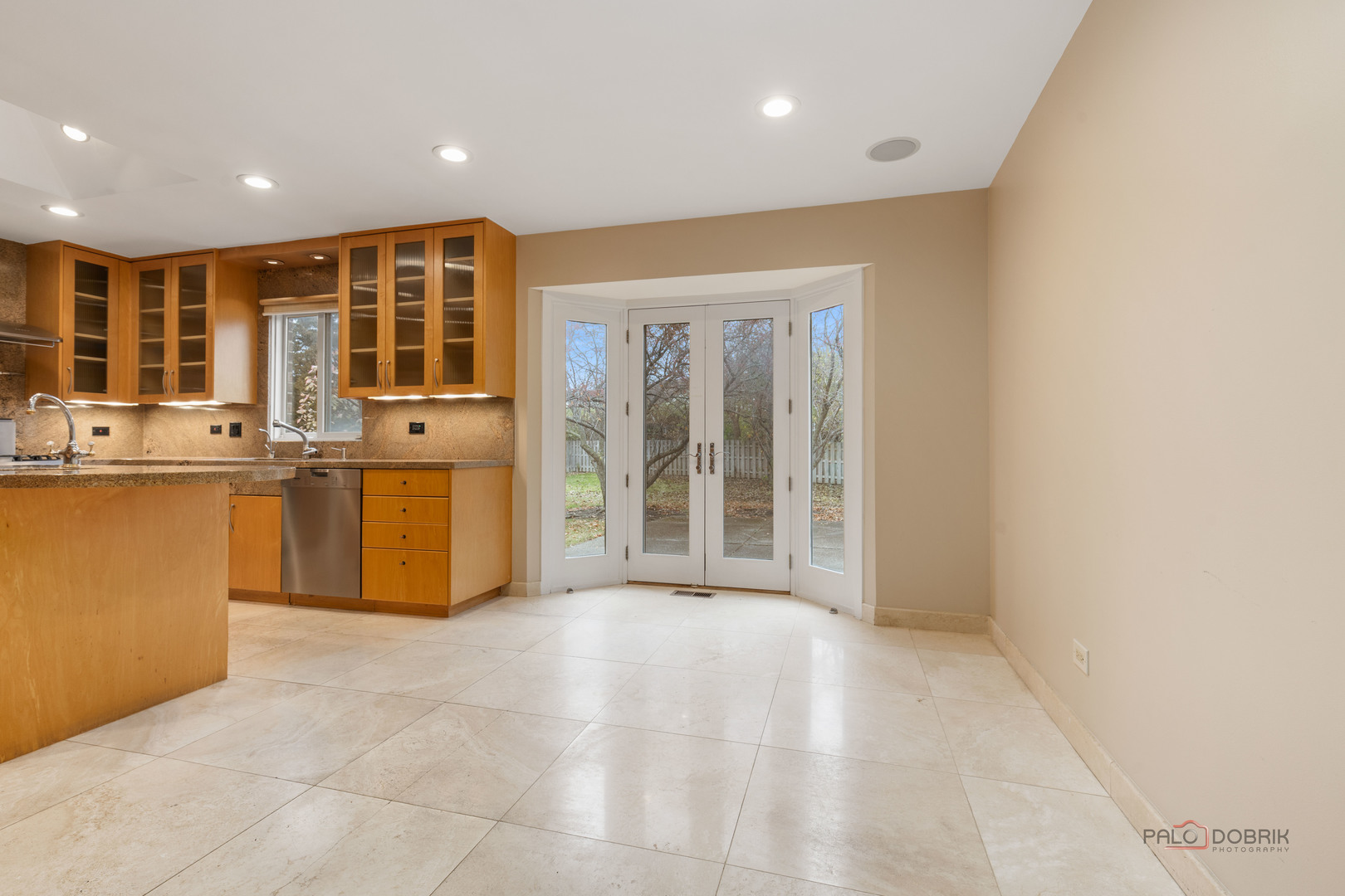 825 Downing Street Northbrook, IL 60062 - Photo 7 of 29 a view of a kitchen with stainless steel appliances granite countertop a refrigerator and a stove top oven