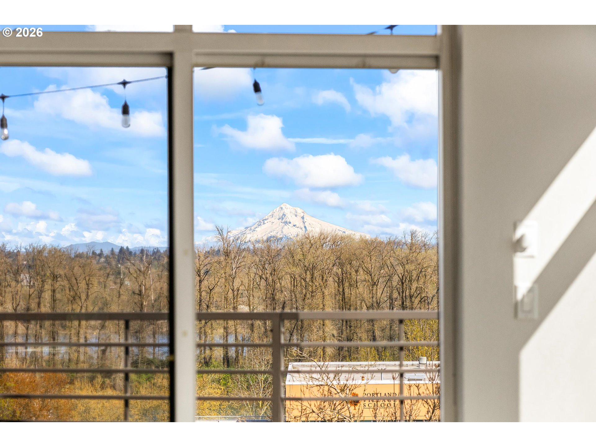 4644 South Kelly Avenue Portland, OR 97239 - Photo 12 of 42 a view of a glass door with a view of sky