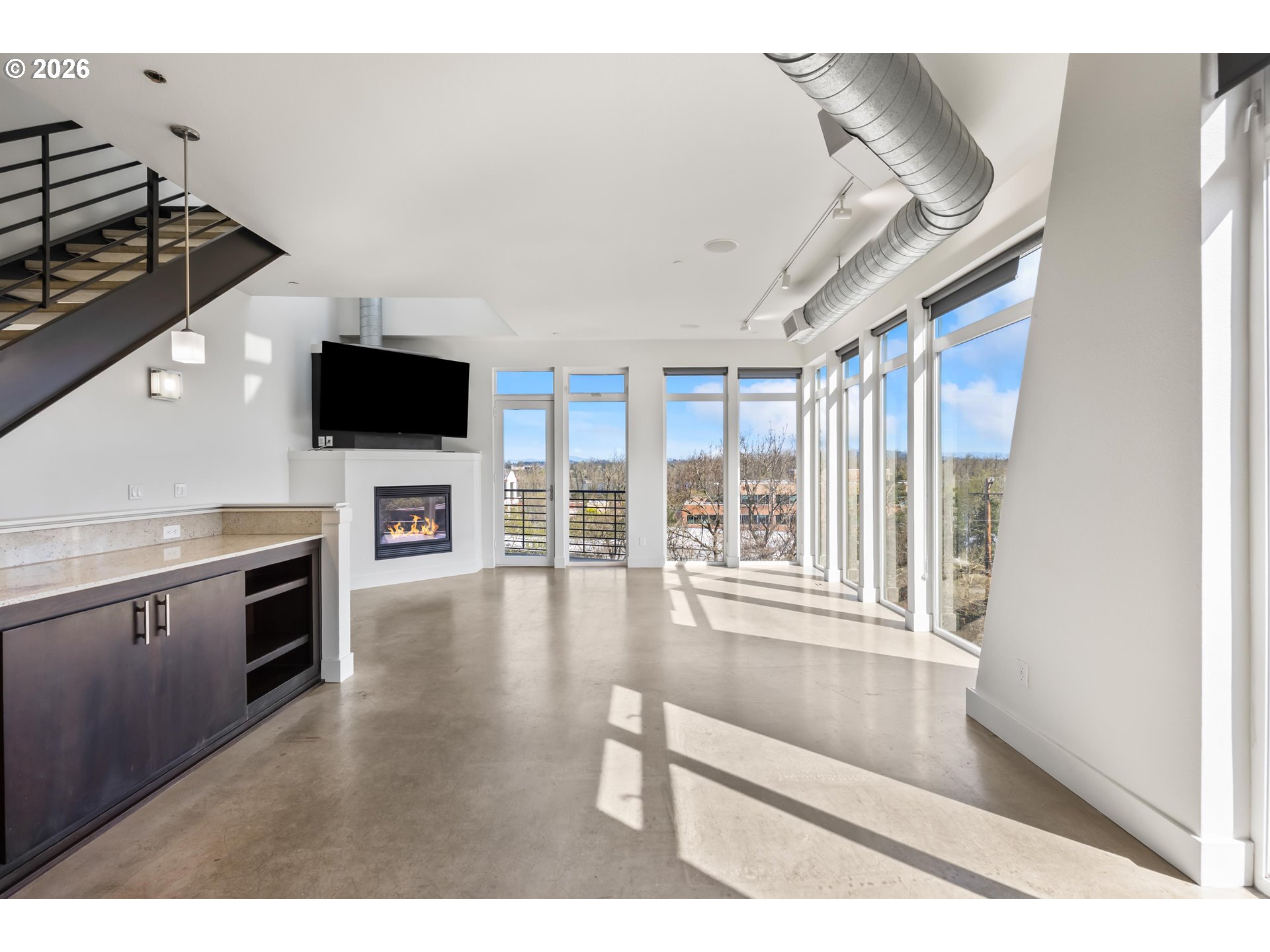 4644 South Kelly Avenue Portland, OR 97239 - Photo 13 of 42 a living room with stainless steel appliances furniture and a flat screen tv