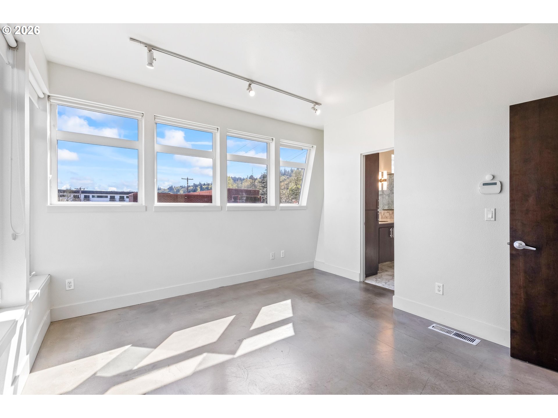 4644 South Kelly Avenue Portland, OR 97239 - Photo 17 of 42 a view of an empty room with a window