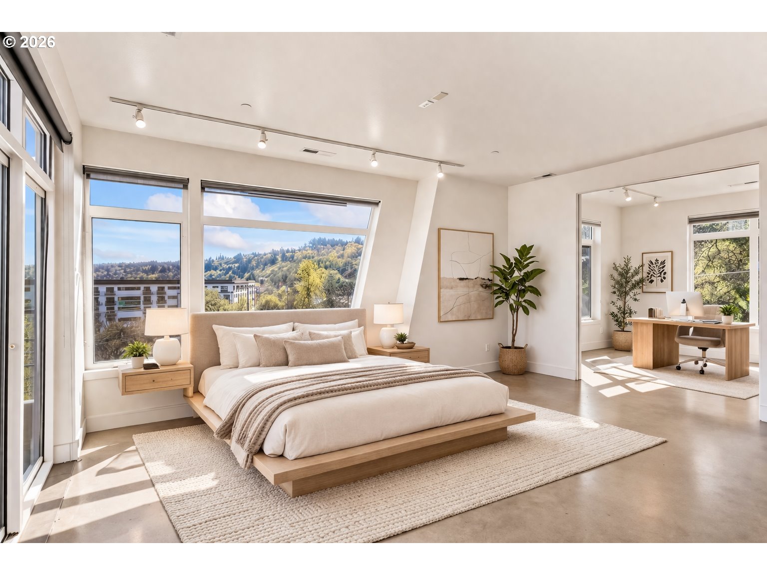 4644 South Kelly Avenue Portland, OR 97239 - Photo 23 of 42 a bedroom with a large bed and a large window