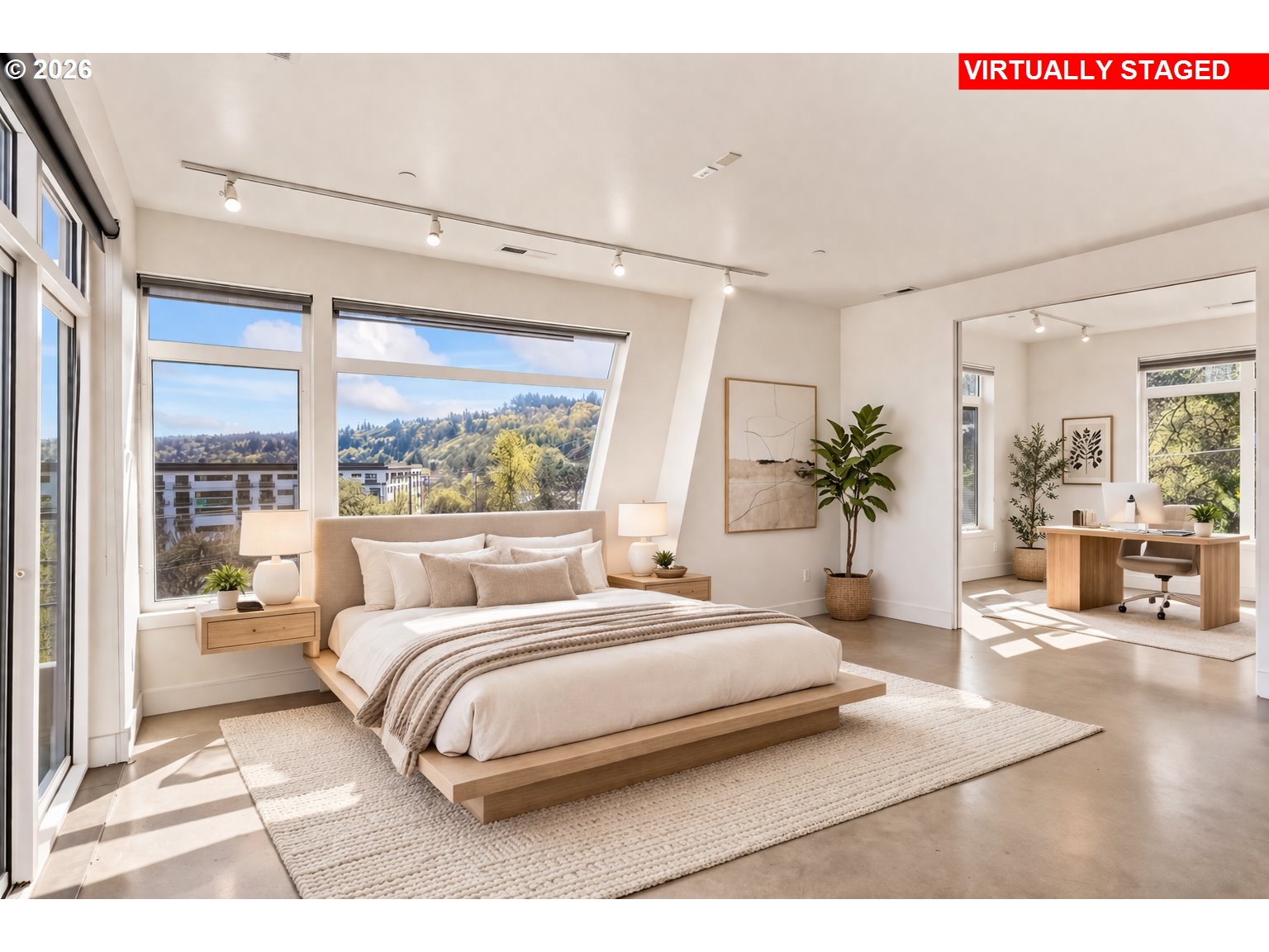 4644 South Kelly Avenue Portland, OR 97239 - Photo 3 of 42 a bedroom with a large bed and a large window