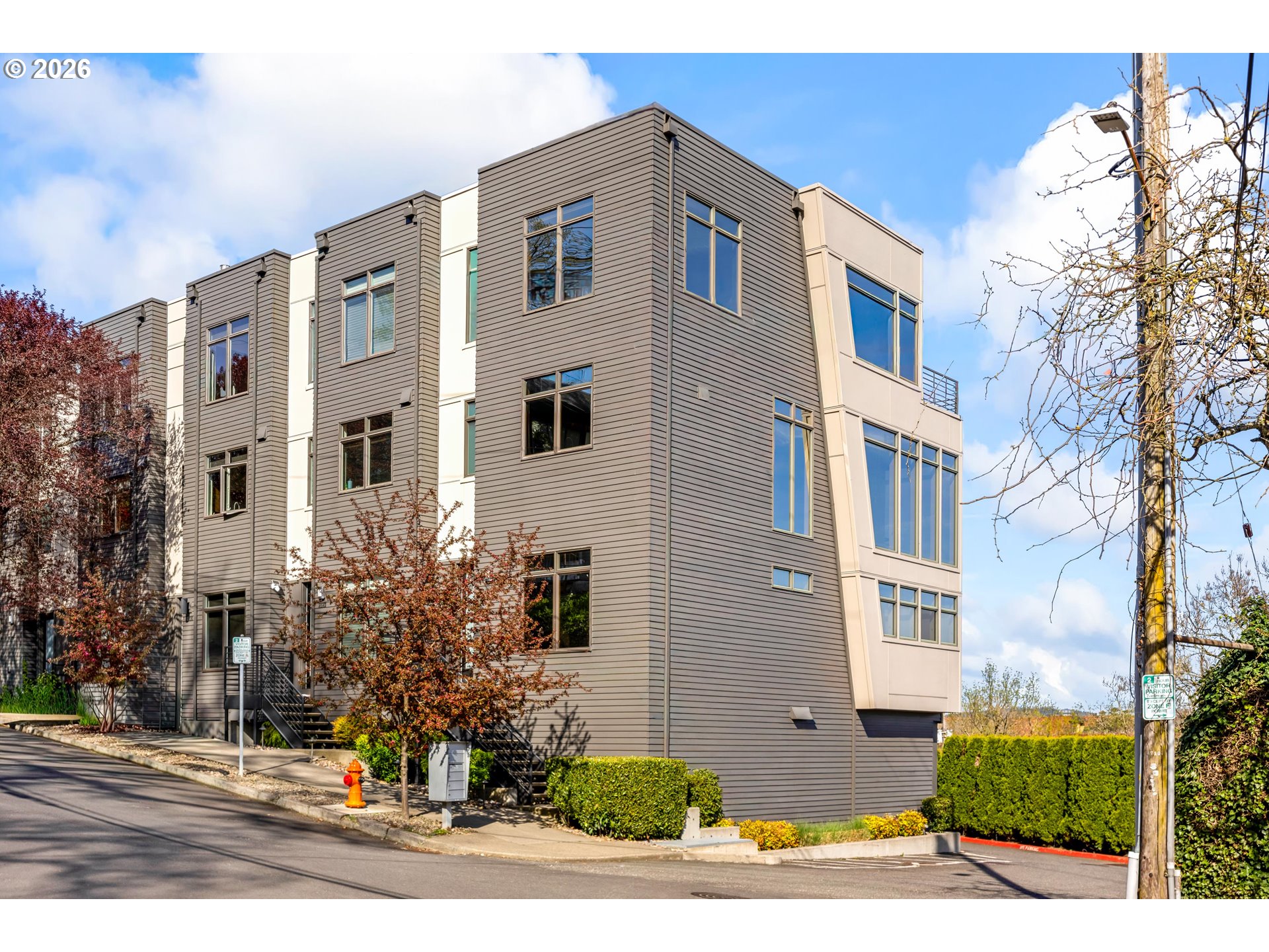 4644 South Kelly Avenue Portland, OR 97239 - Photo 40 of 42 a view of a white apartments with large windows