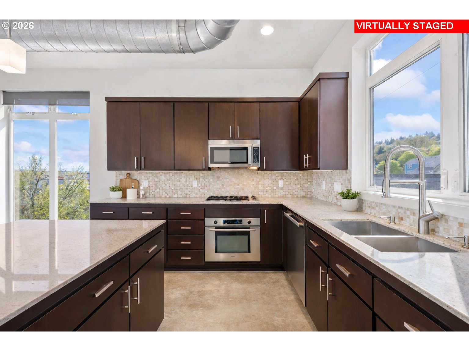 4644 South Kelly Avenue Portland, OR 97239 - Photo 7 of 42 a kitchen with a sink stove top oven and microwave