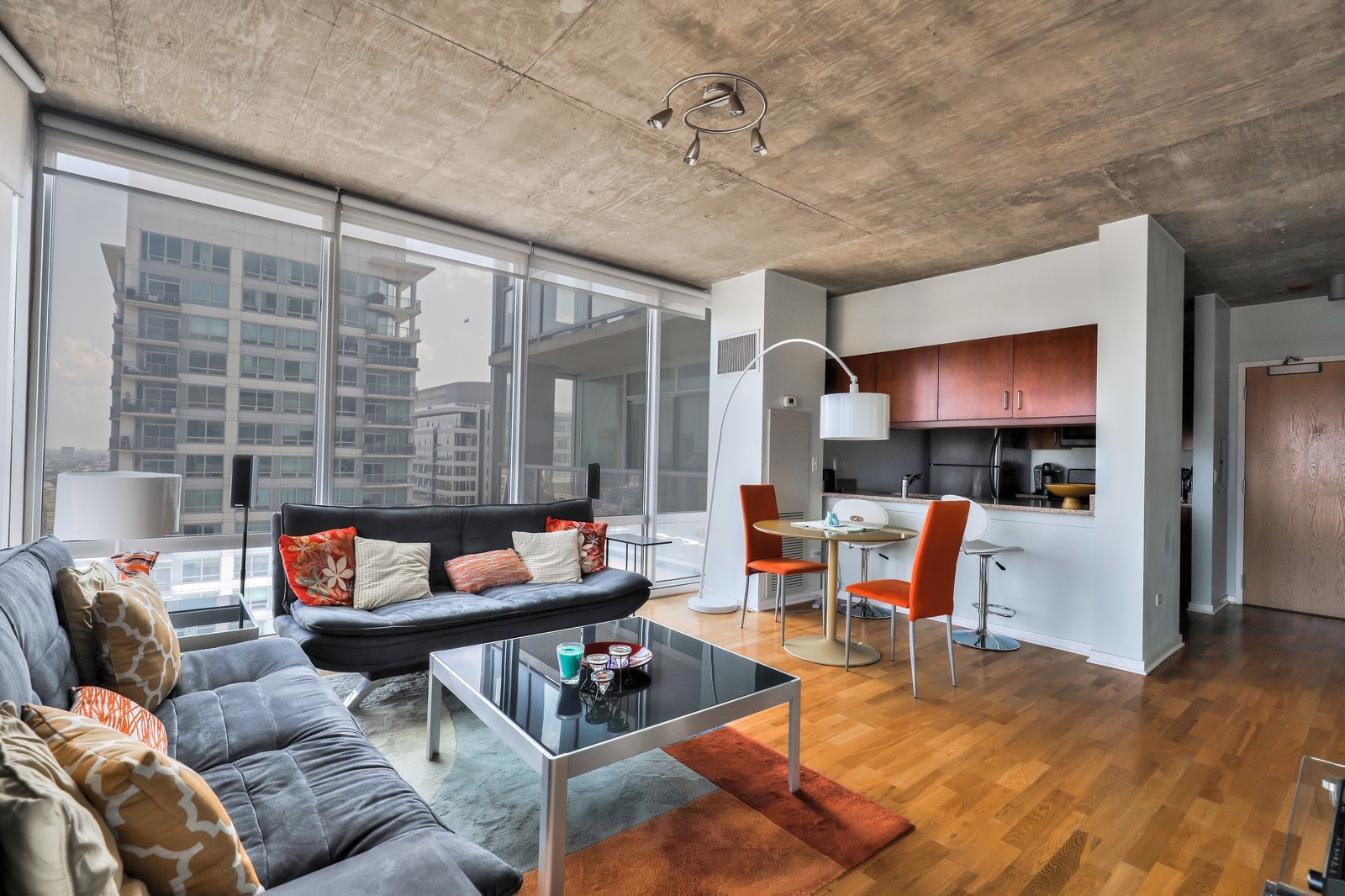 611 South Wells Street, Unit 2808 Chicago, IL 60607 - Photo 5 of 16 a living room with furniture and a flat screen tv