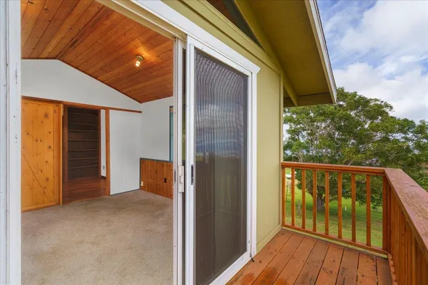 a view of balcony with wooden floor