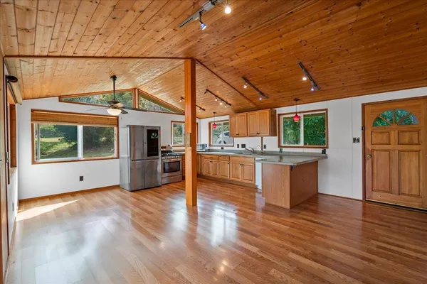 a view of kitchen with furniture and wooden floor