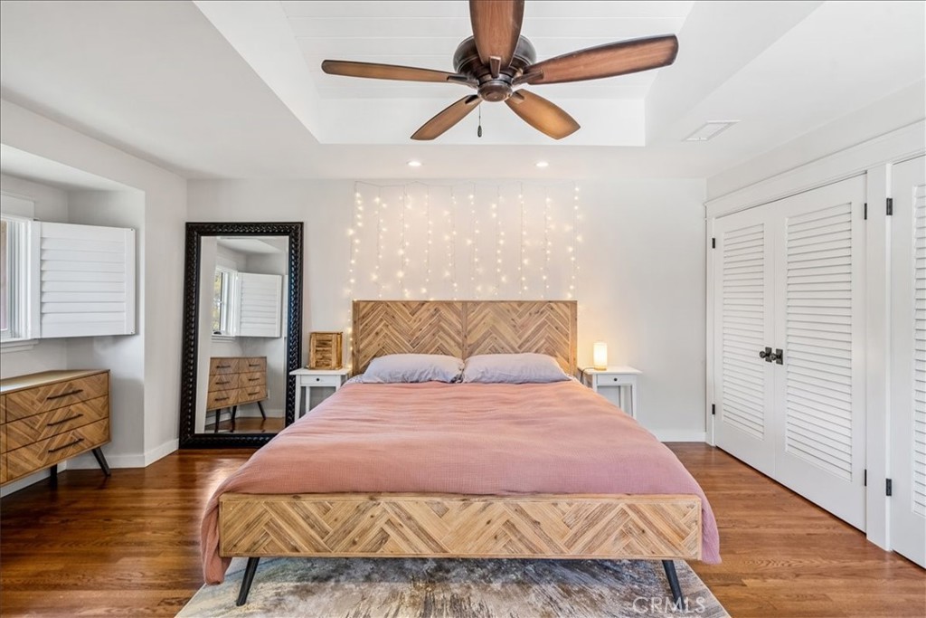 27064 Sunnyridge Road Palos Verdes Peninsula, CA 90274 - Photo 22 of 57 a bedroom with a large bed and a chandelier