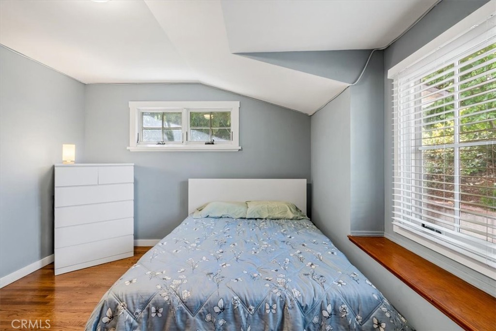 27064 Sunnyridge Road Palos Verdes Peninsula, CA 90274 - Photo 26 of 57 a bedroom with a bed and wooden floor