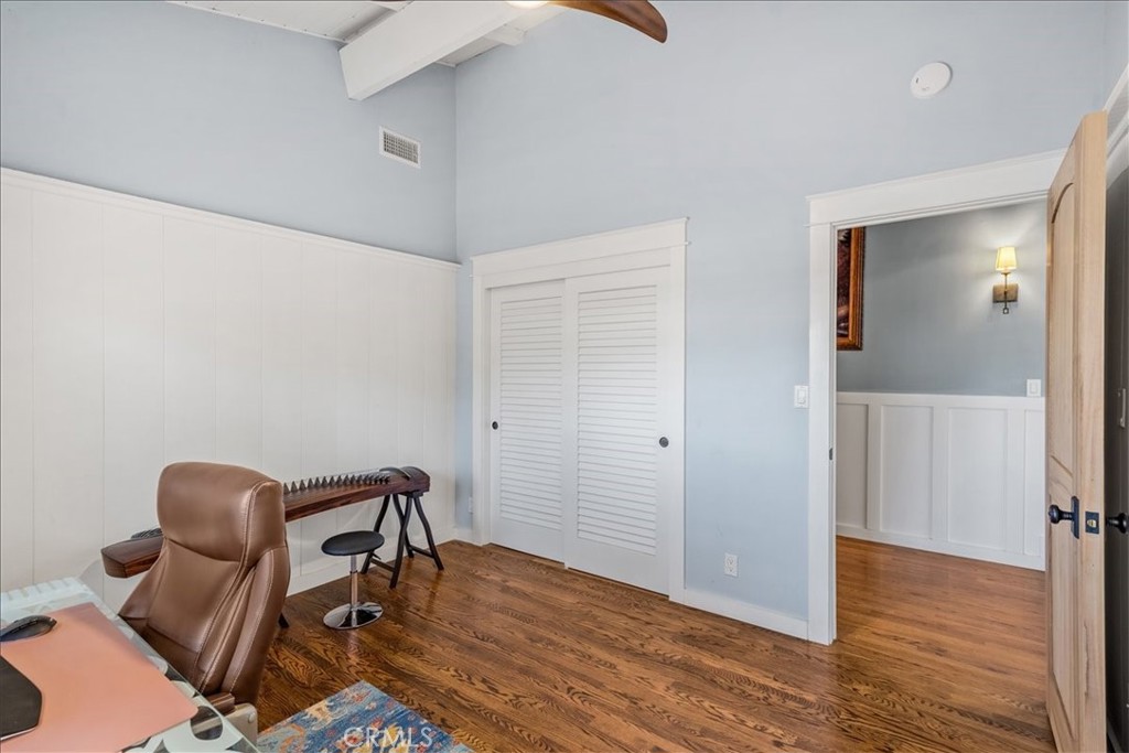 27064 Sunnyridge Road Palos Verdes Peninsula, CA 90274 - Photo 32 of 57 a view of a workspace with wooden floor and lounge chair