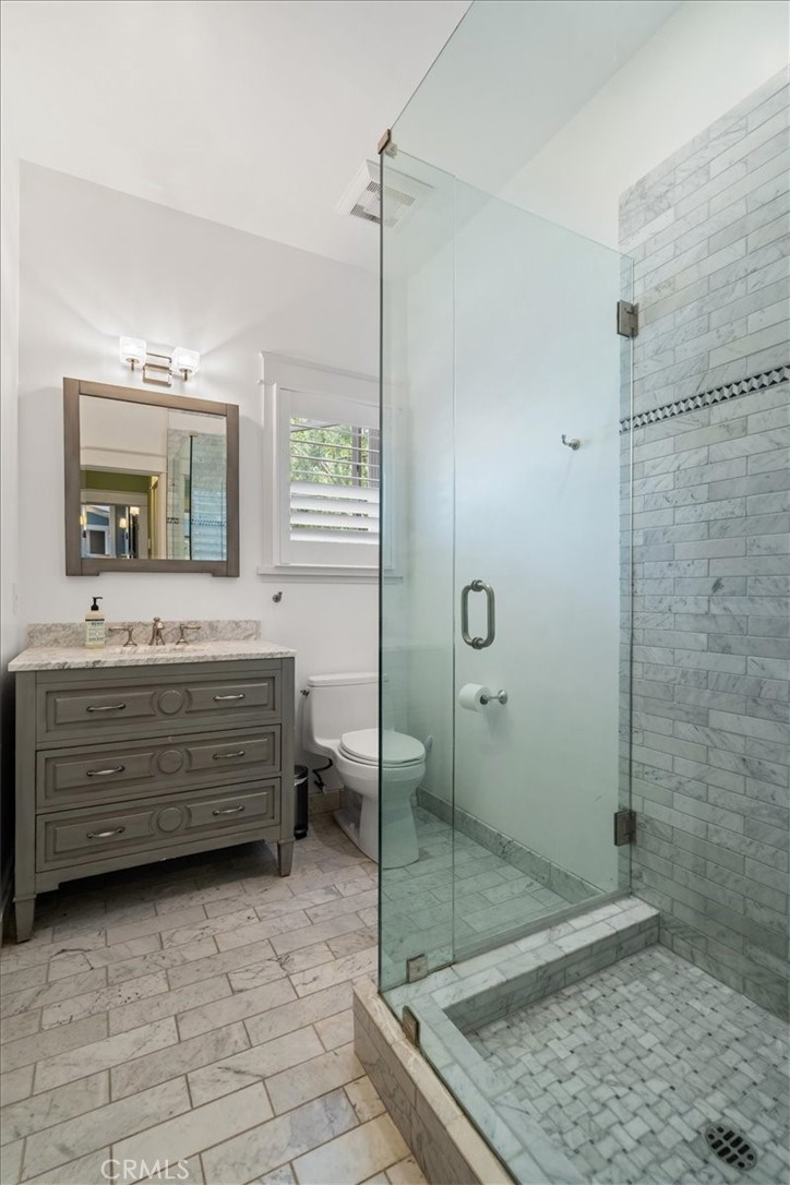 27064 Sunnyridge Road Palos Verdes Peninsula, CA 90274 - Photo 34 of 57 a bathroom with a granite countertop sink mirror and shower
