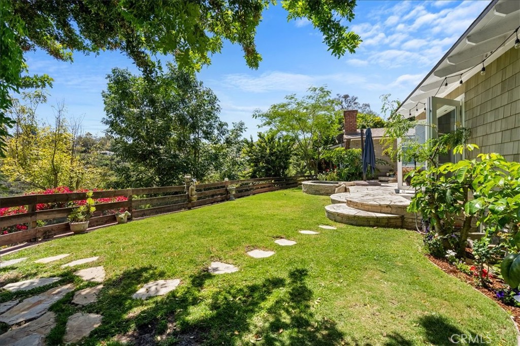 27064 Sunnyridge Road Palos Verdes Peninsula, CA 90274 - Photo 37 of 57 a view of a garden with a bench