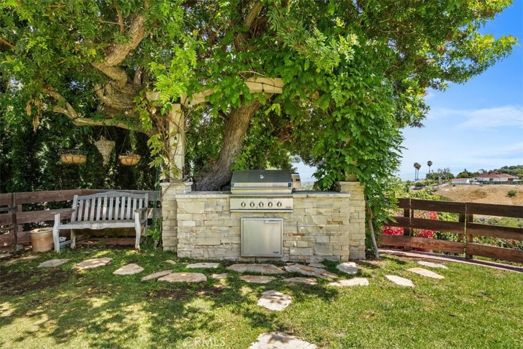 27064 Sunnyridge Road Palos Verdes Peninsula, CA 90274 - Photo 38 of 57 a view of a deck with a floor to ceiling window and wooden fence