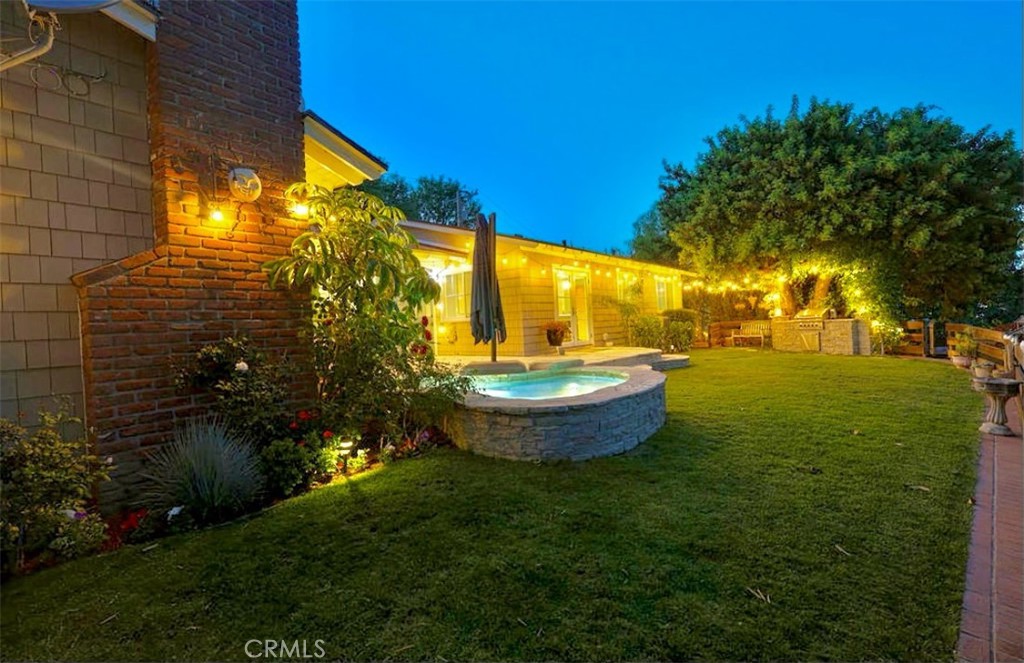 27064 Sunnyridge Road Palos Verdes Peninsula, CA 90274 - Photo 47 of 57 a view of a swimming pool with a garden