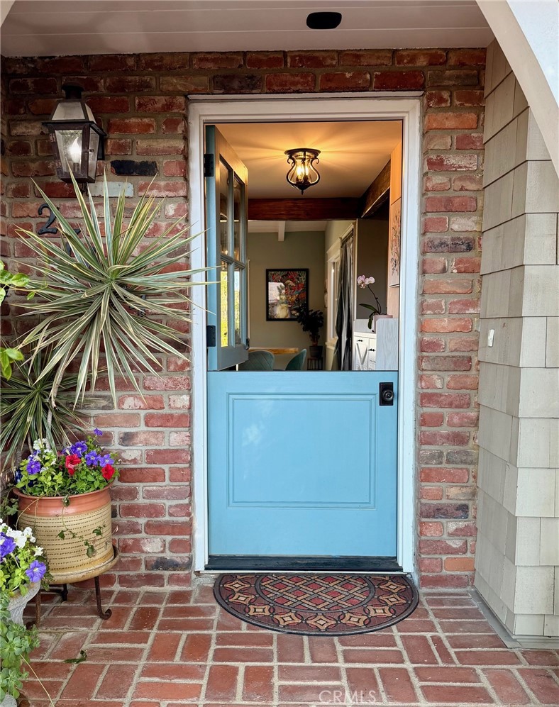 27064 Sunnyridge Road Palos Verdes Peninsula, CA 90274 - Photo 5 of 57 a view of front door of house with potted plant